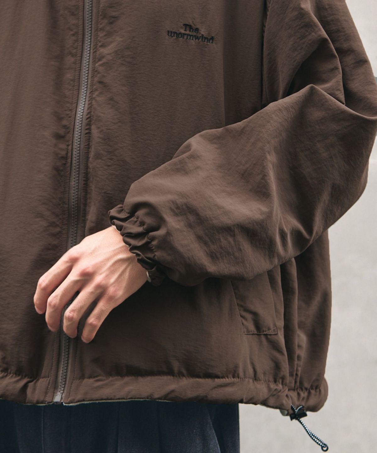 胸刺繍ロゴ裾ドローコードリバーシブルテックナイロン＆フリース長袖